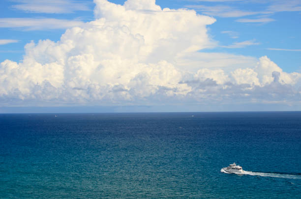 istock Boat on the Atlantic Ocean in Front of a Dramatic Cloudscape 940212766