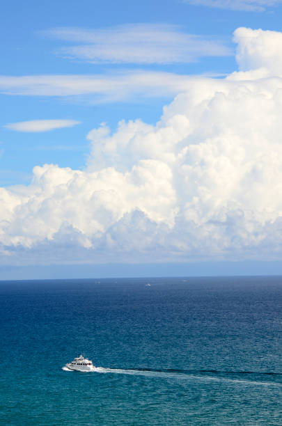 istock Boat on the Atlantic Ocean in Front of a Dramatic Cloudscape 940212806