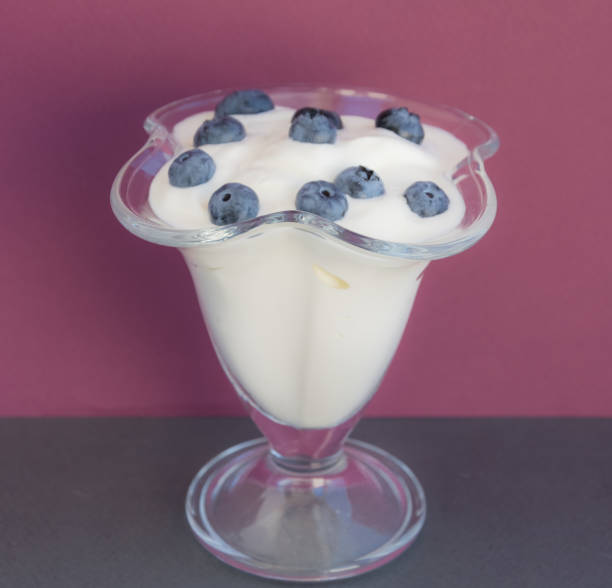 istock Yougurt in glass with blueberry 940212956
