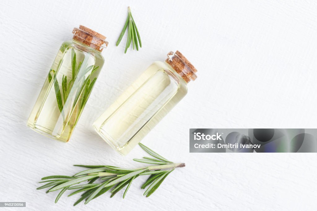 Organic cosmetics with extracts of herbs rosemary. Organic cosmetics with extracts of herbs rosemary on white background. Rosemary Stock Photo