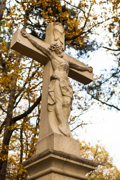 istock Jesus christ on the cross statue 940213848