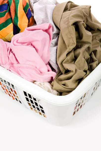 istock laundry basket and dirty clothing 940218084