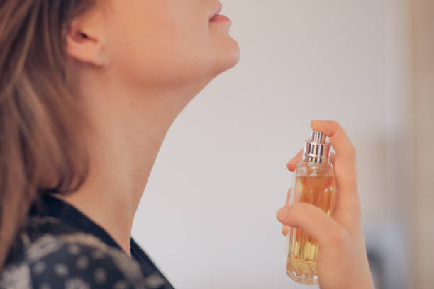 istock The girl sprays a perfume 940229046