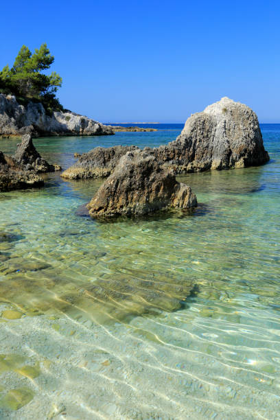 istock Big rocks in crystal clear sea water 940231076