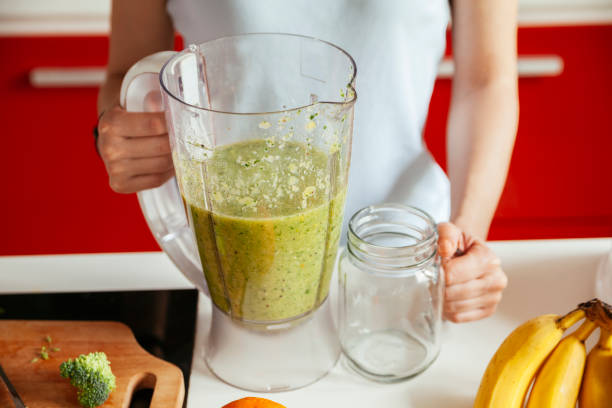 istock Young Woman Made A Green Smoothie 940231310