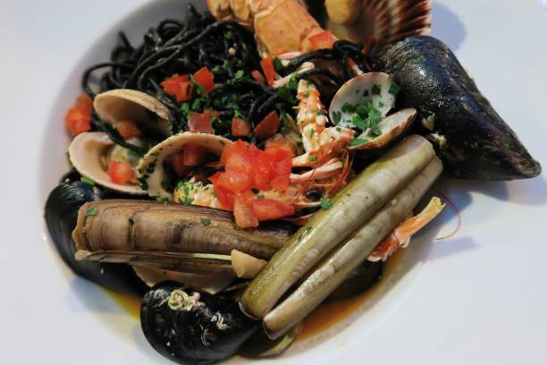istock Cuttlefish ink pasta noodles with seafood 940231324