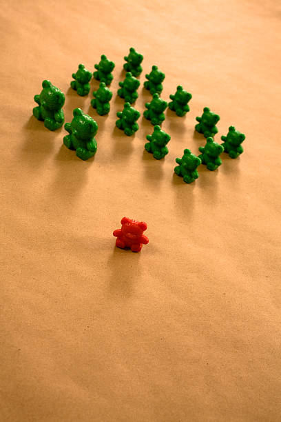 istock One little red bear out of line. 94023473