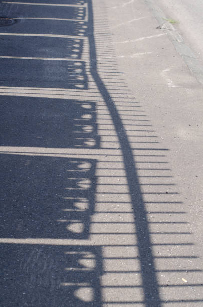 istock Shadow of the fence 940237088