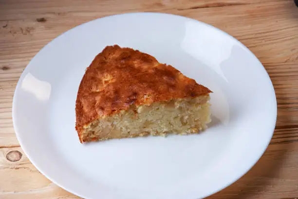 Photo of Fresh Homemade Apple Pie with a Flakey Crust on white plate