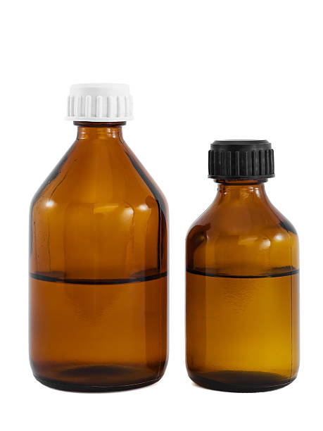 istock Brown glass vials with liquid drug isolated on white 94024875