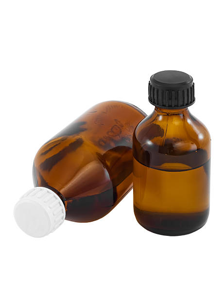 istock Brown glass vials with liquid drug isolated on white 94024876