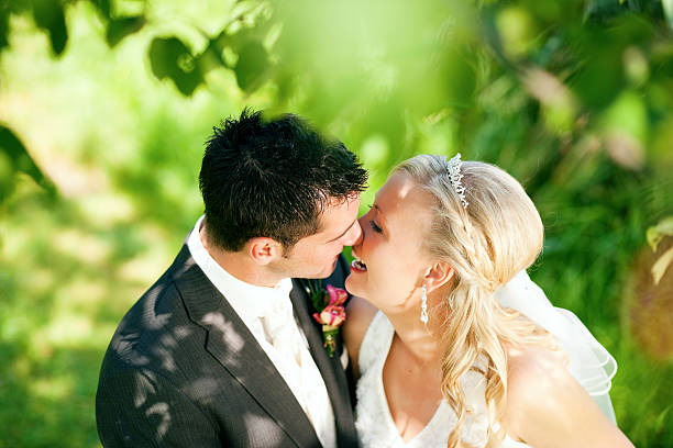istock A wedding couple outdoors about to kiss 94025096