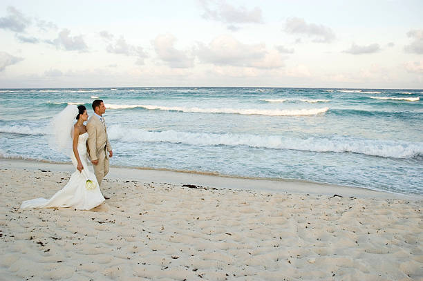 istock Caribbean Beach Wedding - Bride and Groom Walking 94025304