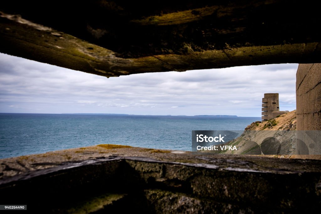 WWII German Naval Tower MP3, Battery Moltke, viewed from bunker, St Ouen, Jersey, Channel Islands. Guernsey Sark and Herm vissible on the horizon. WWII German Naval Tower MP3, Battery Moltke, viewed from bunker, St Ouen, Jersey, Channel Islands. Guernsey Sark and Herm visible on the horizon. Beach Stock Photo