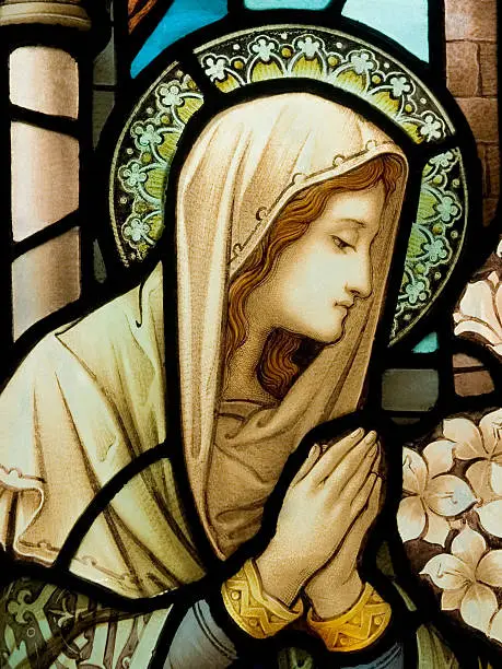 Photo of Stain glass window depiction of our lady