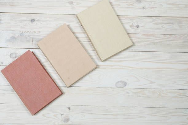 istock Pile of old pastel colors books stacked 940258428