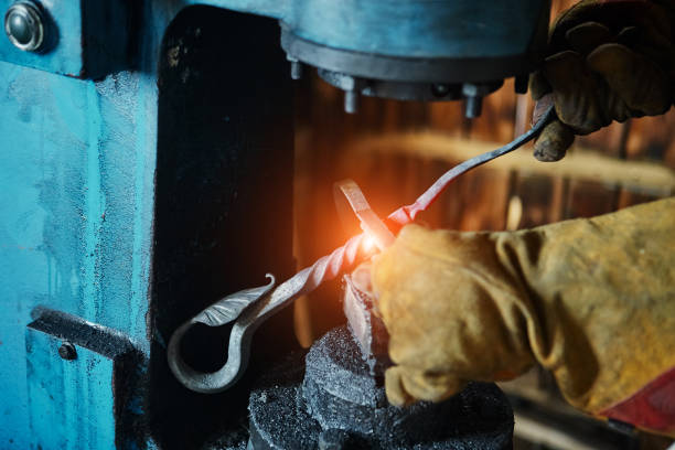istock Forging press. Manufacturer of wrought iron decorative items for pneumatic forging machine 940258838