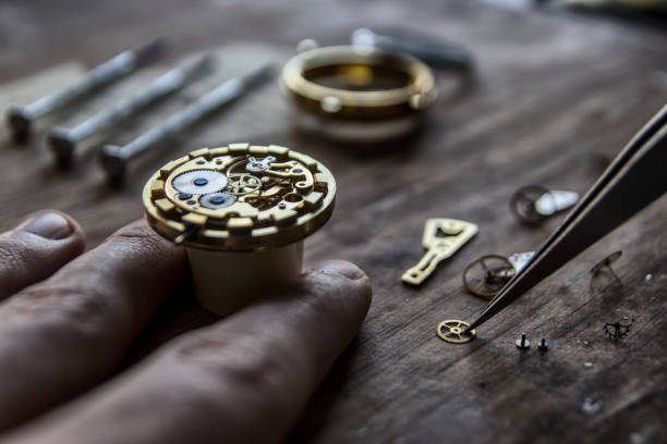 istock Watchmaker is repairing the mechanical watches in his workshop 940260120