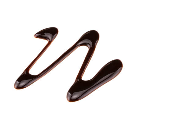 istock sweet chocolate syrup isolated on a white background 940264686