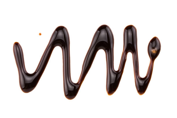 sweet chocolate syrup isolated on a white background stock photo