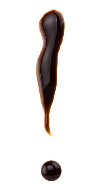 istock exclamation mark made from chocolate syrup, isolated on white 940264736