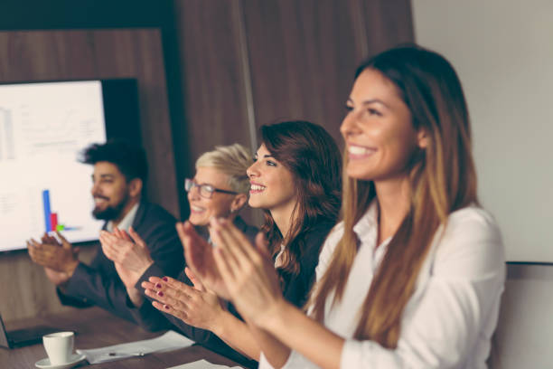 istock Business people applauding after successful presentation 940280448