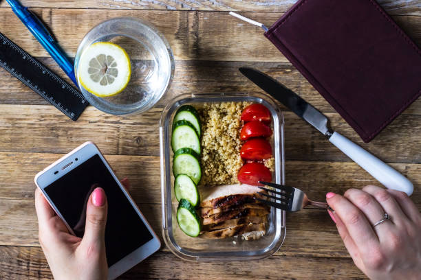 istock Healthy meal prep containers with quinoa, chicken and arugula 940280562