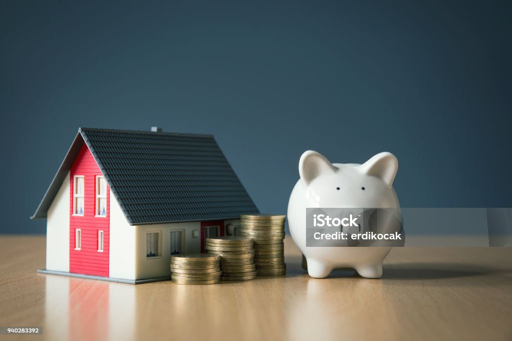 Saving money for house concept with white piggy bank Buying, Finance, Finance and Economy, Home Finances, Home Improvement House Stock Photo