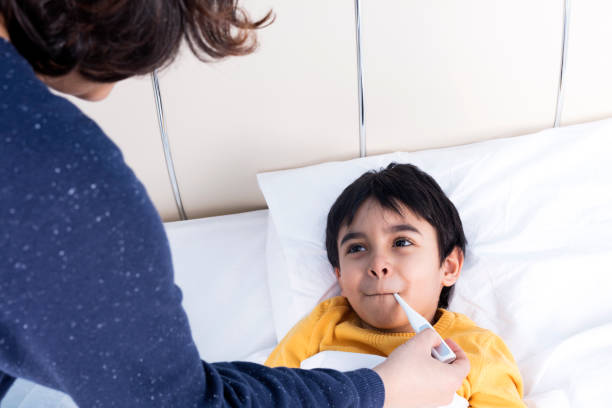istock Sick child with high fever 940283844