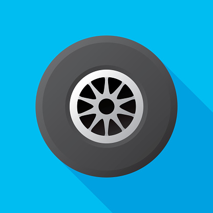 Vector illustration of a car tire with hubcap against a blue background in flat style.