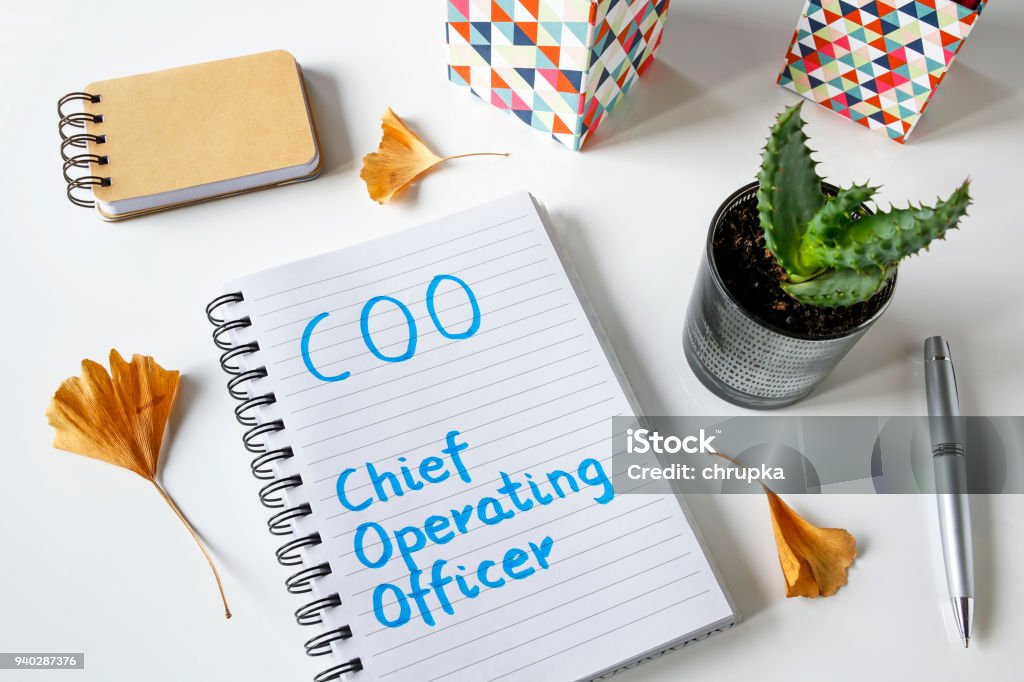 COO- Chief Operating Officer written in a notebook COO- Chief Operating Officer written in a notebook on white table COO Stock Photo