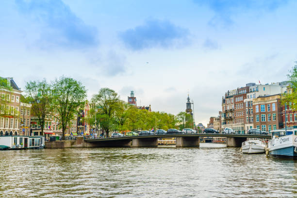 istock Amsterdam, the Netherlands, September 5, 2017 : Amsterdam Netherlands dancing houses over river Amstel 940294728
