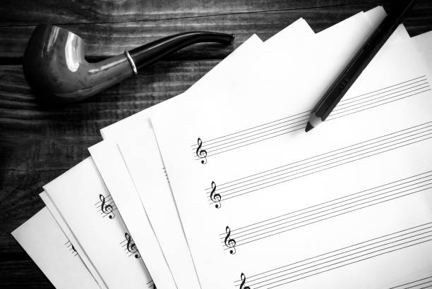 istock Blank music sheet and a smoking pipe 940295022