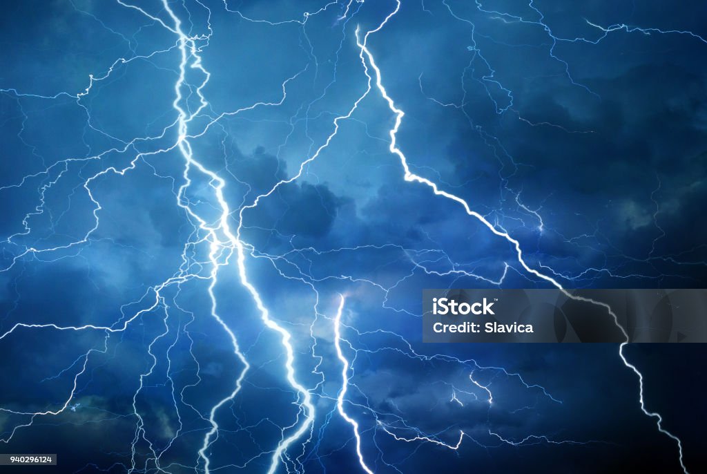 Lightning during summer storm Thunder, lightning and rain during summer storm at night. Lightning Stock Photo