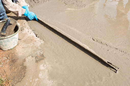 Triangular Plaster Worker Using Triangular Plaster On Fresh Cement Floor Stock Photo ...