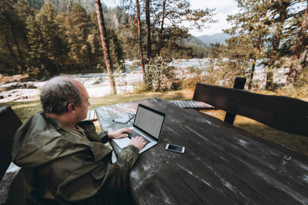 istock Businessman with laptop being on leave 940303162