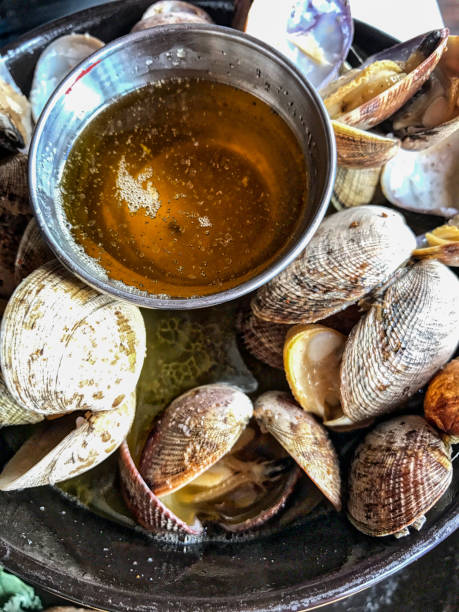 Closeup of steamed clams with melted butter