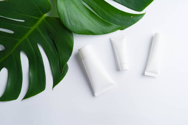 istock Beautiful natural cosmetics and leaves on light background 940303518