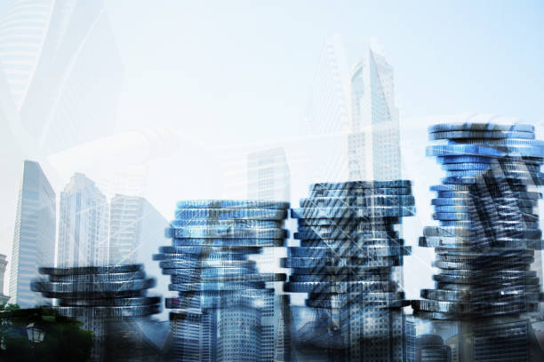 istock Double exposure Stack of coin with financial graph over city and office building background, business and financial concept. 940306188