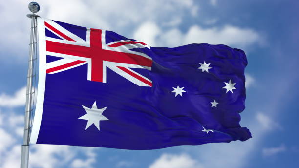 istock Australia Flag in a Blue Sky 940318048