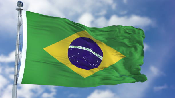 istock Brazilian Flag in a Blue Sky 940318200