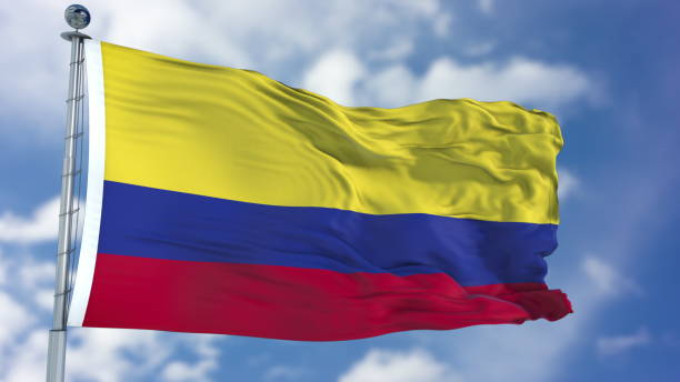 istock Colombia Flag in a Blue Sky 940320348