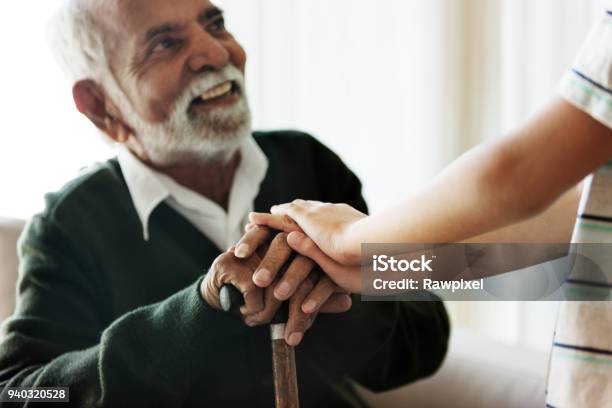 Grandson Holding Grandpas Hands Stock Photo - Download Image Now - Senior Adult, Nursing Home, Multiracial Group