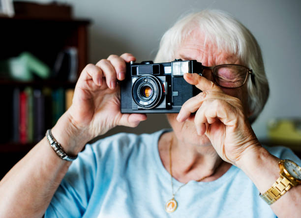 istock Senior woman taking a picture 940320654