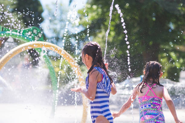 istock A summer afternoon at the splash pad 940320812