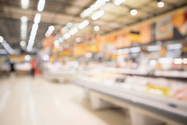 istock Abstract supermarket grocery store blurred defocused background with bokeh light 940320844
