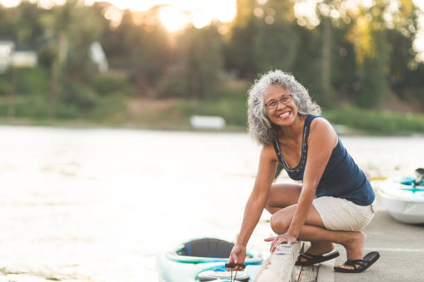 istock A beautiful ethnic older woman prepares to go kayaking 940320860