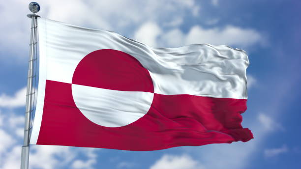 istock Greenland Flag in a Blue Sky 940321576