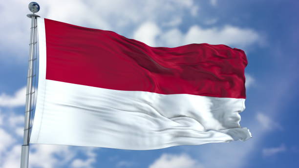 istock Indonesia Flag in a Blue Sky 940321740