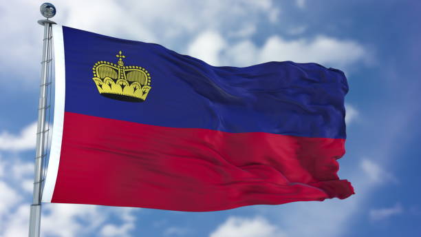 istock Liechtenstein Flag in a Blue Sky 940324424